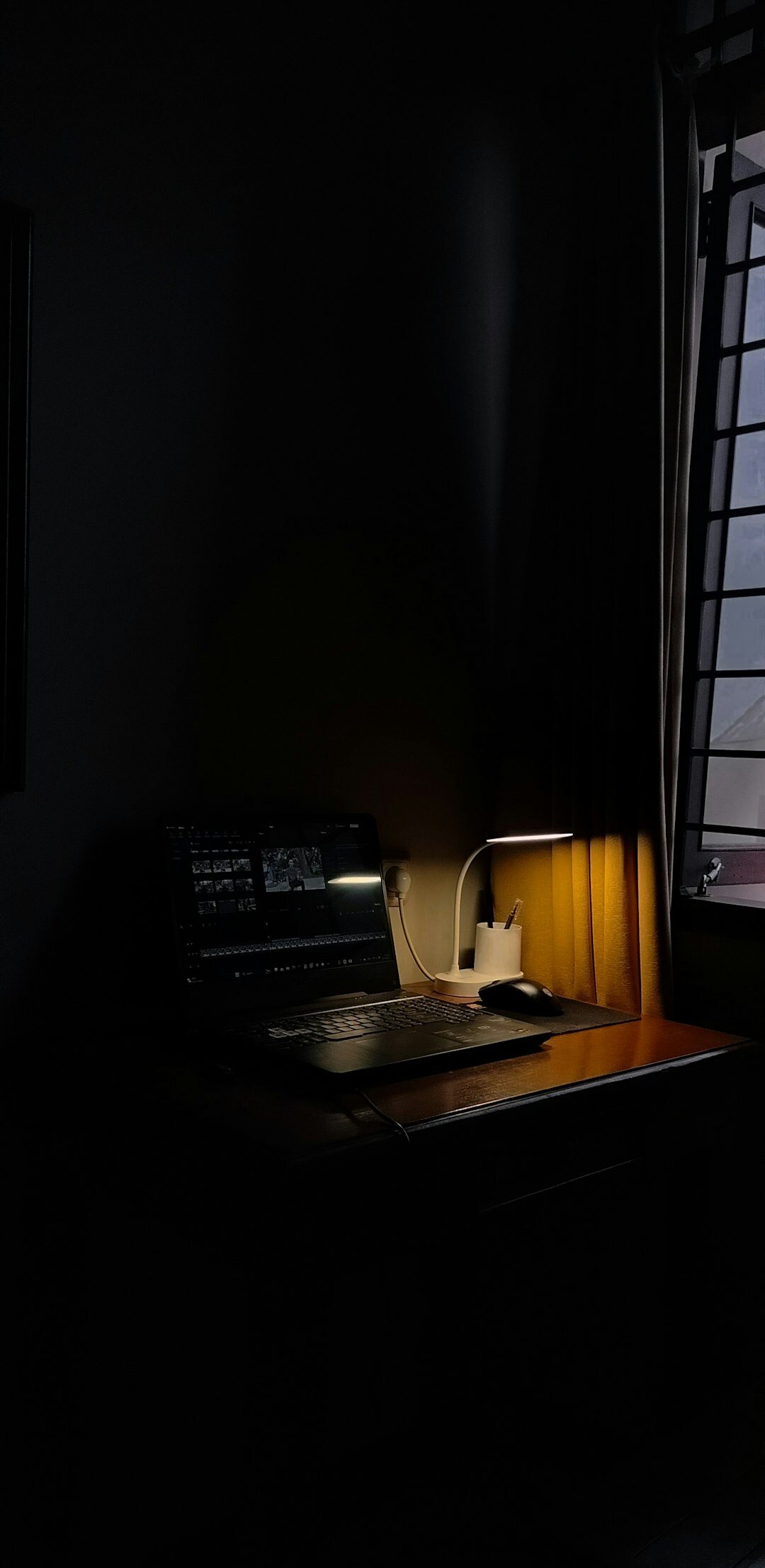 mystery writer typing in dark room