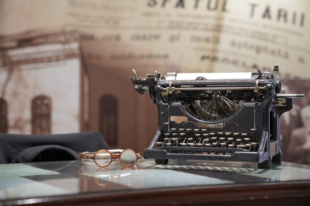 writer typing on typewriter